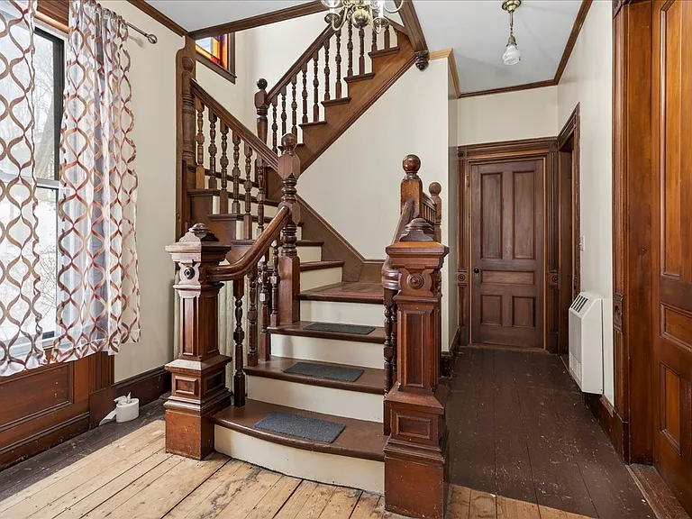 Stairs on the first floor to the second floor apartment