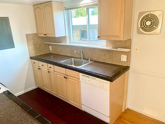 Granite countertop with tile trim and backsplash.