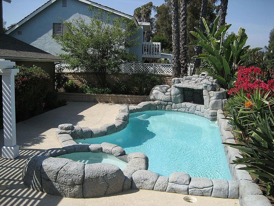rock pool and spa with waterfall