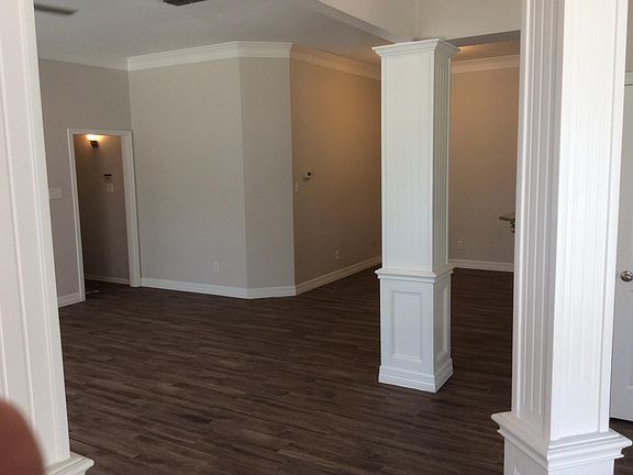 Breakfast area behind center pillar. Entry hallway on left to master suite. Picture taken from living room.