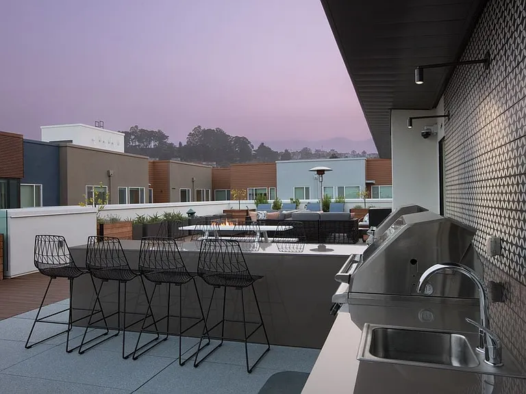 Rooftop deck with barbecue grills and common area seating