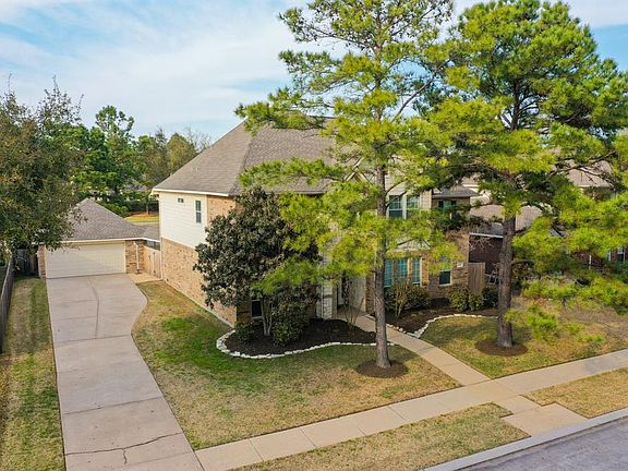 Check out this aerial! From this vantage we get a full view of the beautiful mature trees in the front yard and that awesome oversized detached garage. Also, a new garage door was installed in 2018! It has a networked opener w/ battery backup!