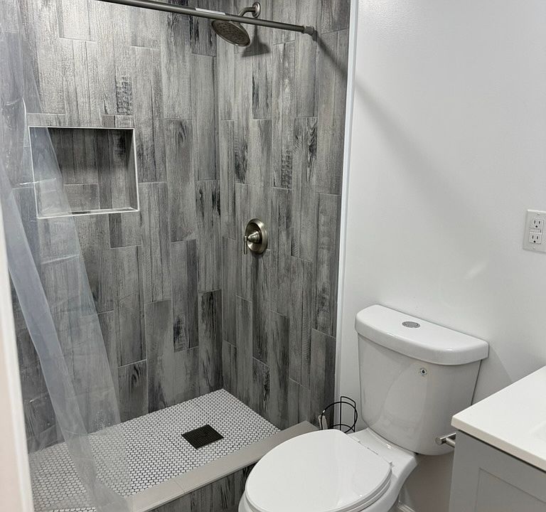 New Bathroom with Tile throughout apt
