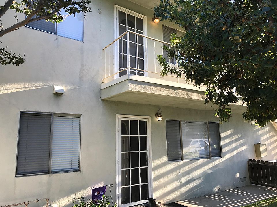 Upstairs unit with trees in courtyard
