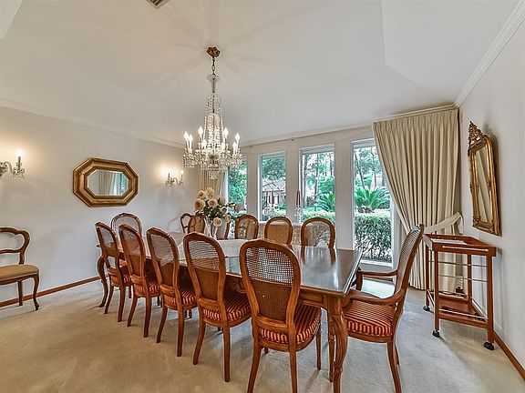Bright formal dining room is spacious enough to host a large group and overlooks the quiet tree lined street.
