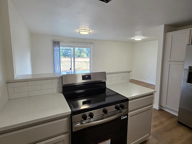 Nice sized cabinets on both sides of the stove/oven