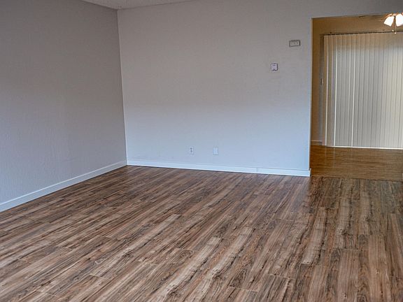 Wood laminate floor on first floor, carpet upstairs.