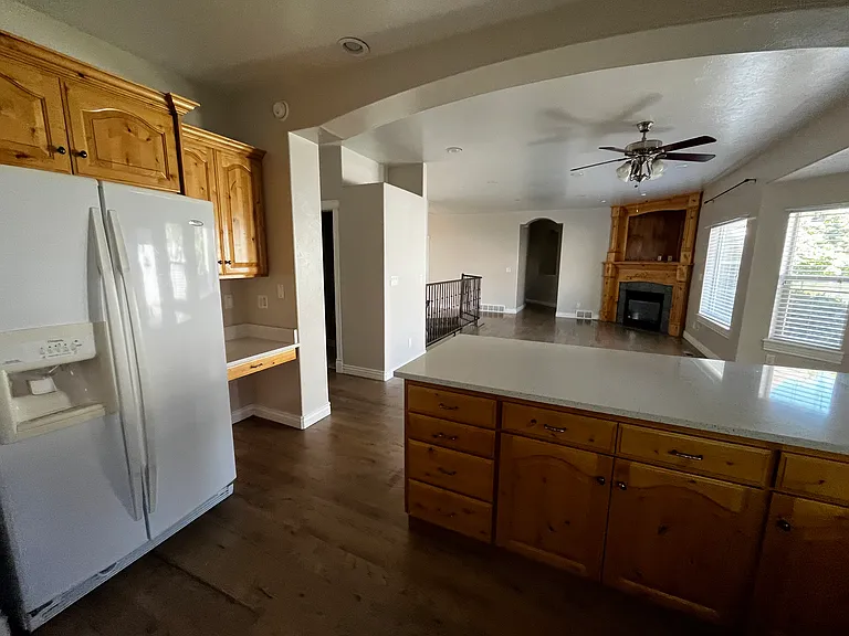 Kitchen opens into dining and living areas.