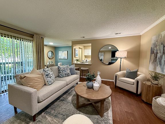 Spacious living room with hardwood-style flooring
