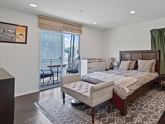 Primary bedroom with private balcony.