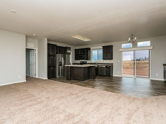 Very open & spacious split floor plan.  9' flat ceilings, extra large upgraded Low-E vinyl windows, skylights, high transom windows, 9' flat ceilings, 2" faux wood blinds, upgraded trim & paint throughout.