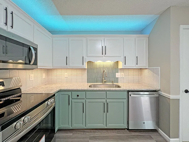 Full suite of SS appliances, custom tile backsplash, granite counter tops, over and under LED cabinet lighting