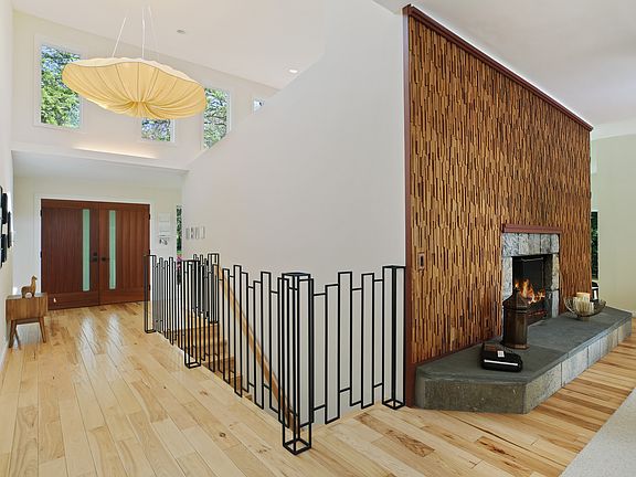 Entry foyer with custom wrought iron railing