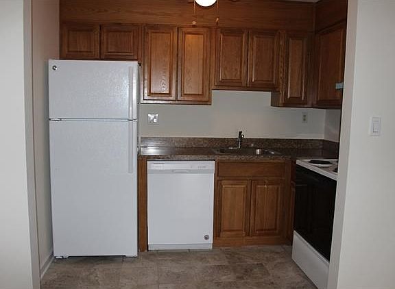 Updated kitchen with new flooring, appliances, and counter tops.