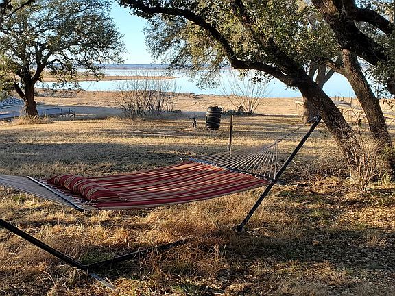 Relax in the huge shaded backyard and watch the sunset over Lake Buchanan.