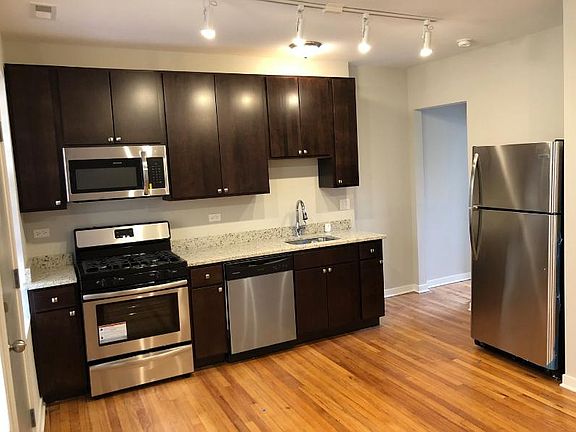 Modern Kitchen with Stainless Steel Appliances including Dishwasher