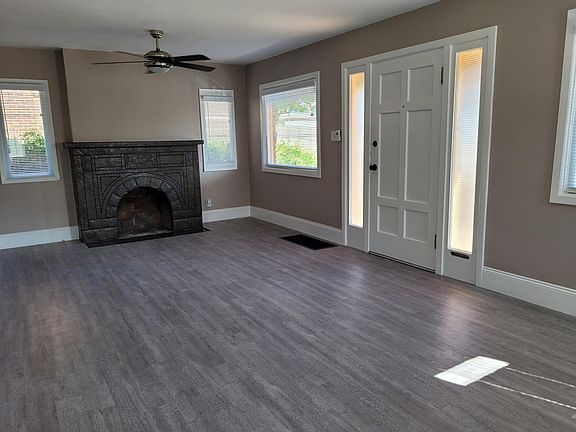 living room w/wood-burning fireplace
