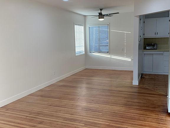 Inside living room looking at dining room and kitchen