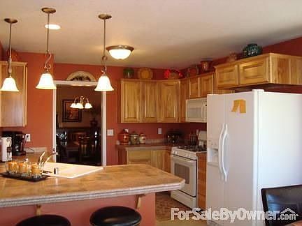 Kitchen and dining from nook : ceramic counter tops, pantry, bar area,