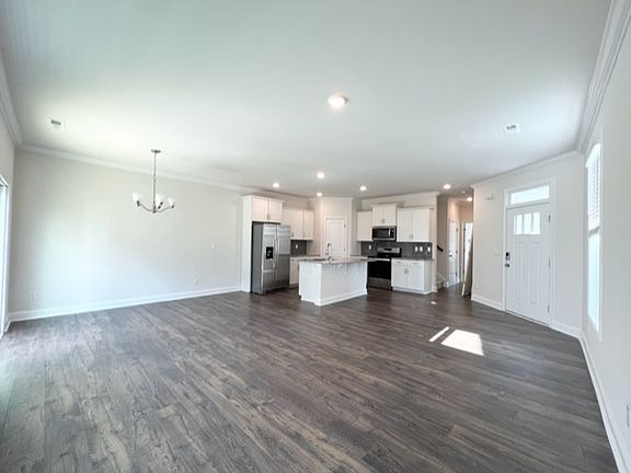 Open floor plan on main level includes dining area, kitchen and living area.
