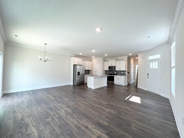 Open floor plan on main level includes dining area, kitchen and living area.
