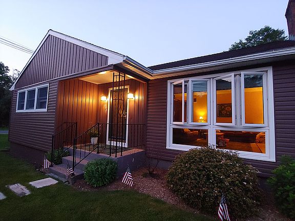 FRONT OF HOUSE - EVENING