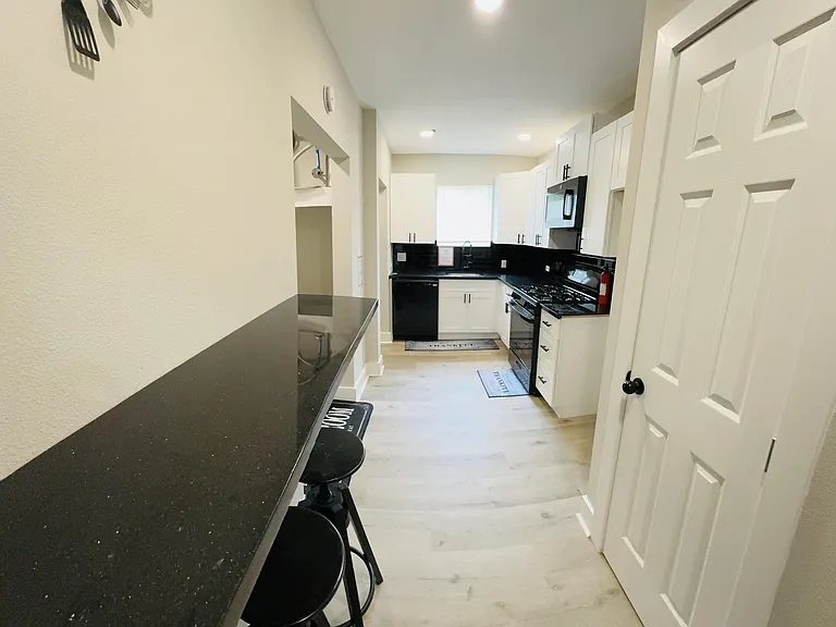 Kitchen with Gas stove, microwave, & dishwasher