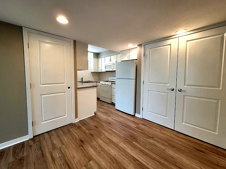 Open concept dining area with laundry closet and kitchen