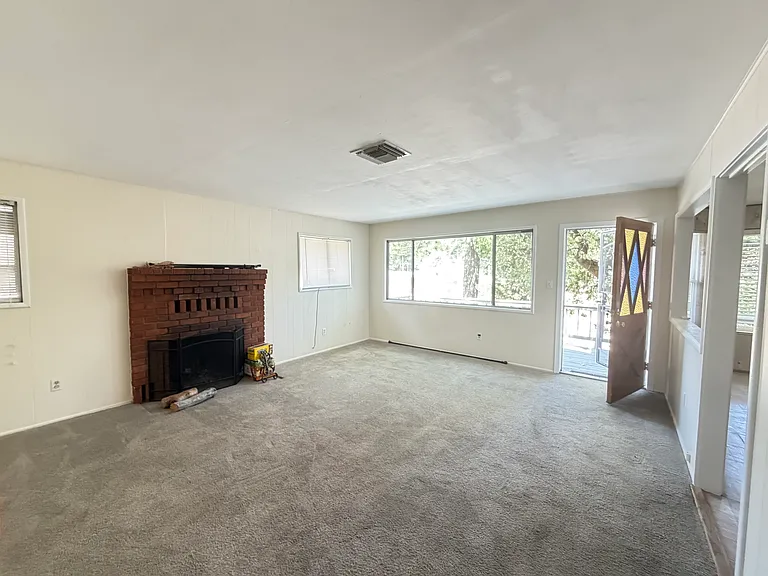 Living room and front door entry.