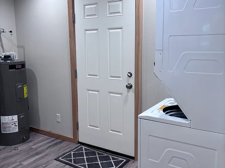 Back door, utilities, washer and dryer