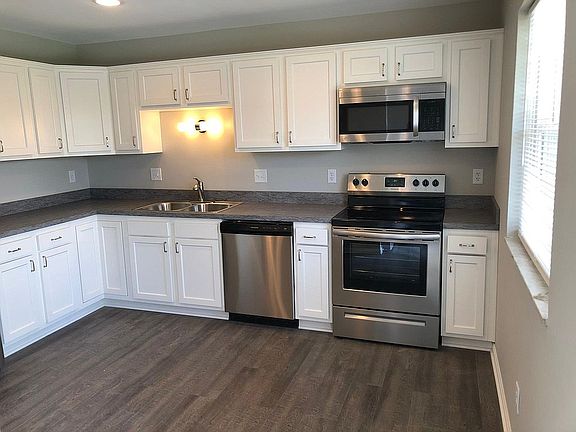 Brand new smooth top range with new over the range microwave.