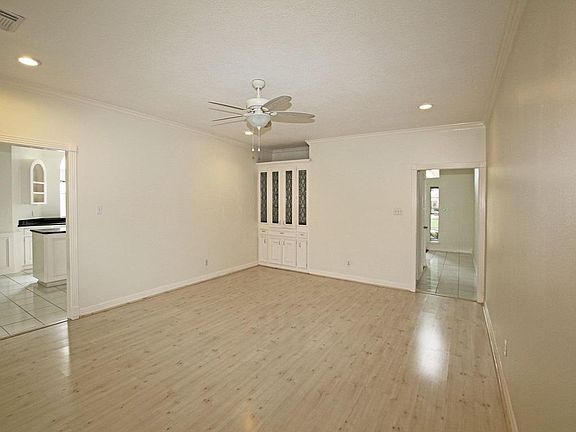 The Spacious Family Room has a Built In Wet Bar. With Leaded Glass Panels.