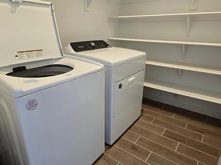 Laundry room with brand new top of the line appliances