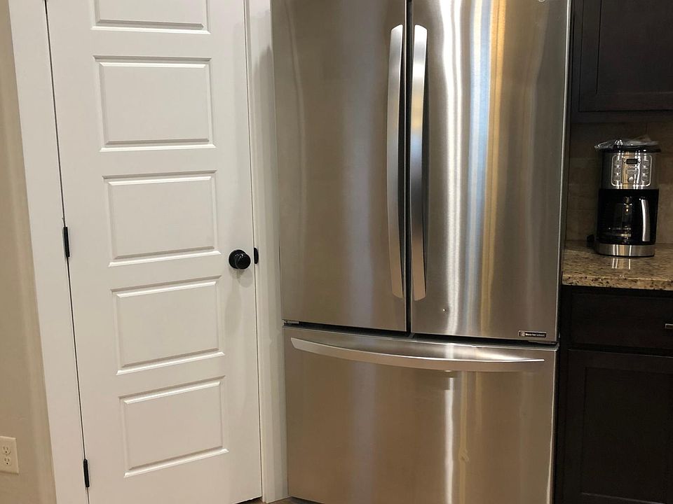 Kitchen Pantry door and refrigerator