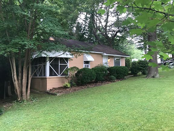 Front of house with view of screened porch