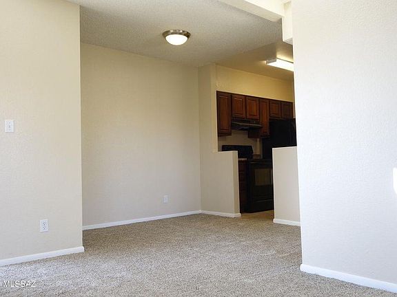 view of dining area and kitchen from living room