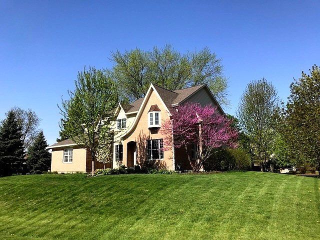 Welcome to 7465 Farrell Drive at The Ponds of Turnberry in The Village of Lakewood. Handsome brick & cedar custom on a truly lovely & private extra wide half acre estate lot in the shade of ancient oaks. Near Golf & beautiful Crystal Lake beaches.