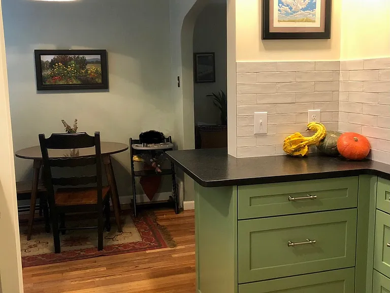Kitchen looking into dining area (when previously furnished by homeowners)
