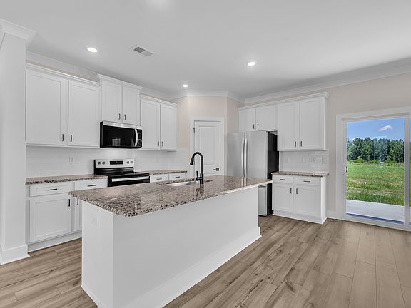 The kitchen has a spacious kitchen island.
