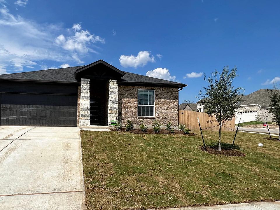 Gorgeous curb appeal, stone elevation, long driveway, corner lot offering lots of sunlight into the home.