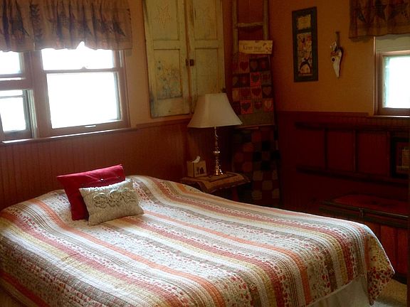 2nd bedroom with queen size bed and his and her closet space