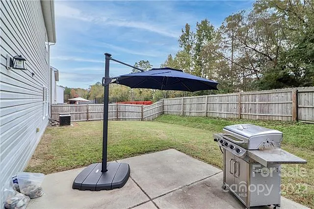 fenced in backyard with woods for privacy