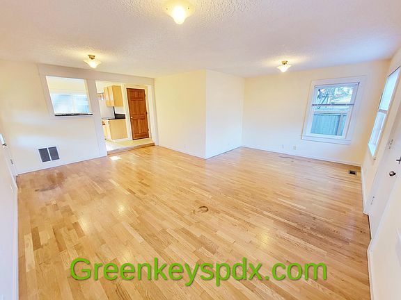 Spacious living room and gorgeous hardwood floors