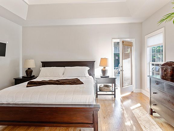 Main bedroom with entryway to patio side door.