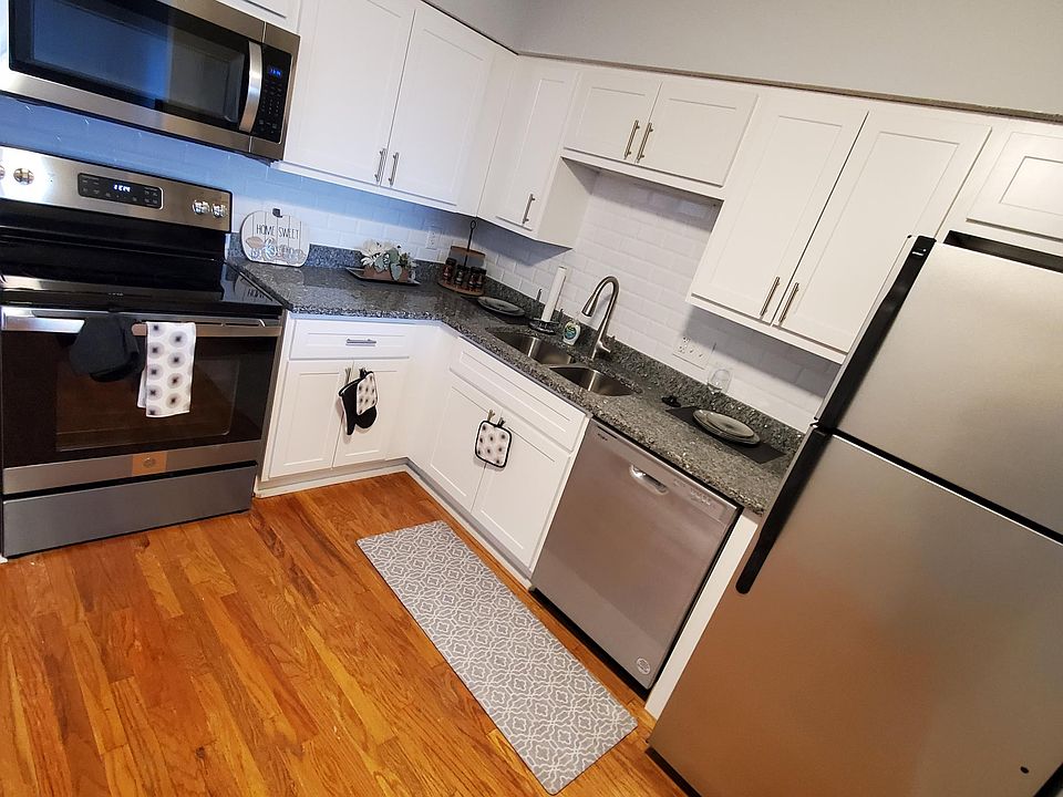 Brand New White Kitchen Cabinets with Caledonia Granite