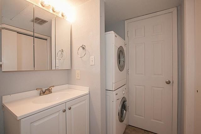 Gated patio area with outdoor closet