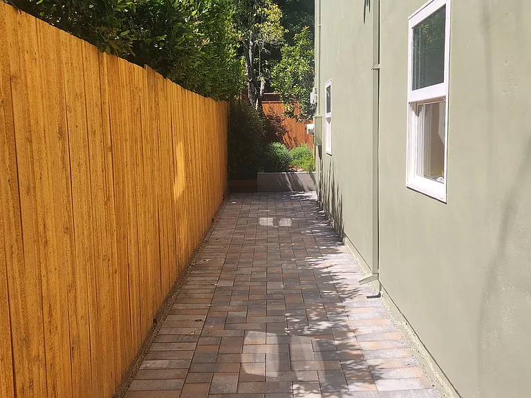 West side-yard walkway facing yard