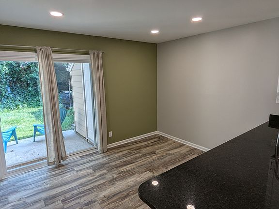 Sliding glass door to backyard space. Includes raised beds, and a 5x5 storage shed.