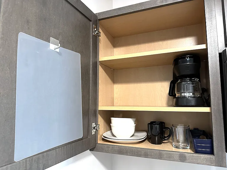 -4 cup drip coffee maker
-2 mugs, 2 glasses, 2 plates, 2 bowls
-cutting board and knives
-2 forks, 2 spoons, 2 knives
-Bottle opener