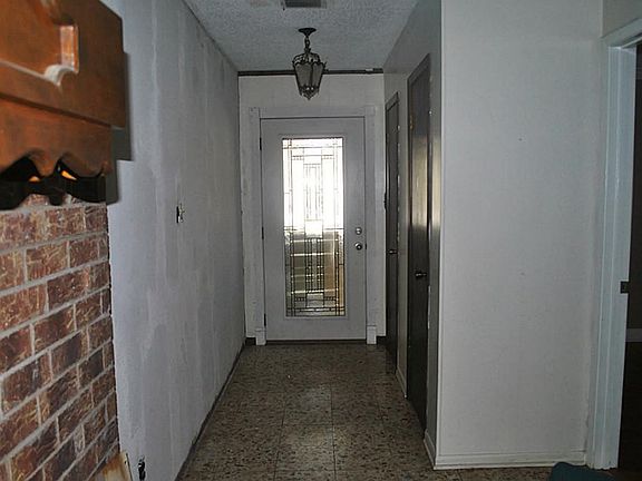 Entry hall showcases the new leaded glass door.